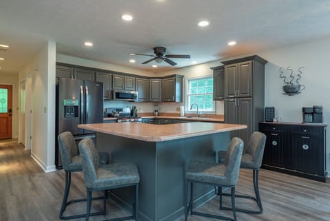 Well-equipped kitchen with gas range, dishwasher, and coffee bar with standard, drip-style coffee maker and Keurig