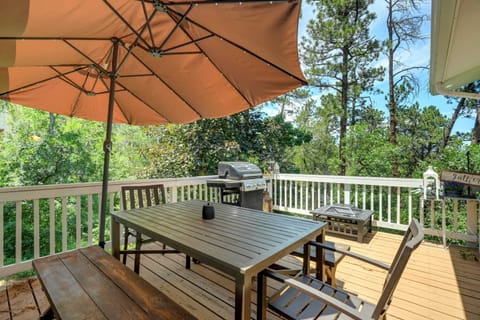 Unwind in outdoor seating area with stunning treetop views