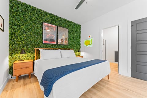 Golf-themed king bedroom with ensuite bathroom—comfort and style for golf lovers. 