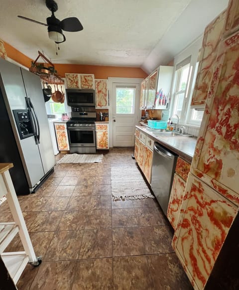 Kitchen - equipped with dishwasher, stove, microwave, coffee/tea station.