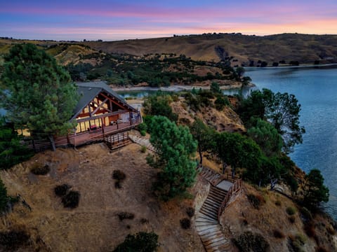 Aerial view of lakefront property with private dock on Lake Nacimiento