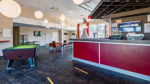 Play a round of billiards with friends and family.