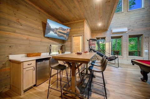 Enjoy the game on the TV or grab a drink from the built in wet bar