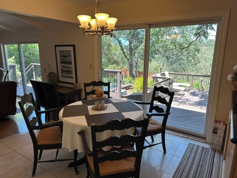 Dining 2 adjacent to the kitchen view over pool and patio