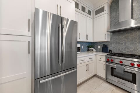 Full size refridgerator and ice maker with water dispenser makes beach days easier!