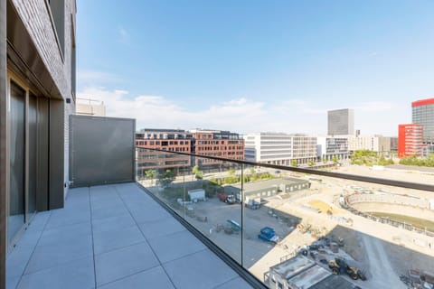 Private balcony offering panoramic views of the surrounding cityscape.