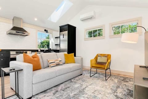 Relax on the couch or catch the afternoon light from the skylight above.