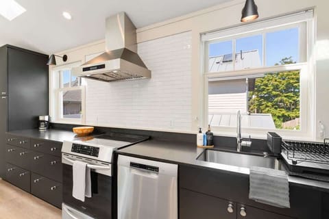 Cook meals or prep snacks. Kitchen includes essentials and a full stove.