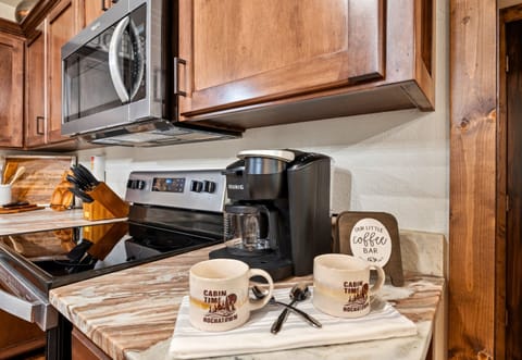 Start your day with a fresh cup of coffee from our cozy coffee bar. Equipped with everything you need