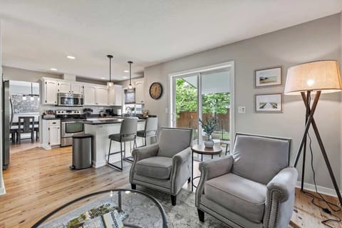 Living room with sliding doors to outside covered living space and grill area