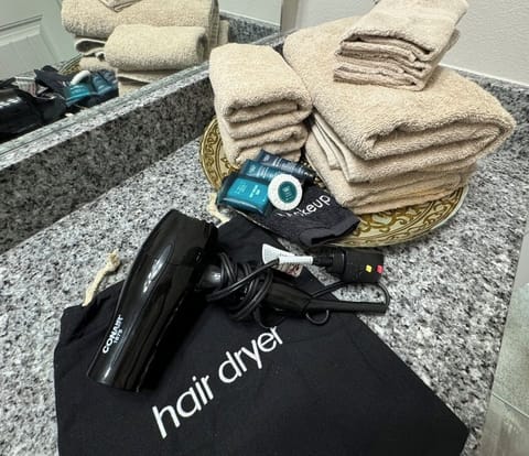 Shower, hair dryer, towels, soap