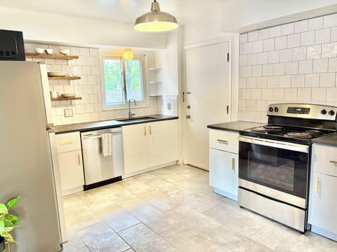 Beautiful renovated kitchen w fridge, dishwasher, disposal, electric range, oven