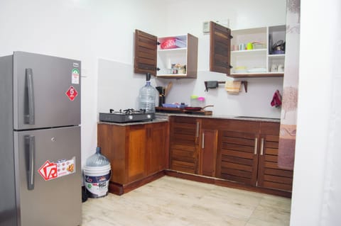 Fridge, microwave, electric kettle, cookware/dishes/utensils