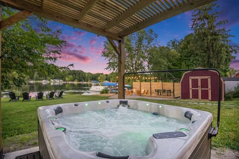 Relax and unwind in the hot tub while enjoying the scenic lake view.