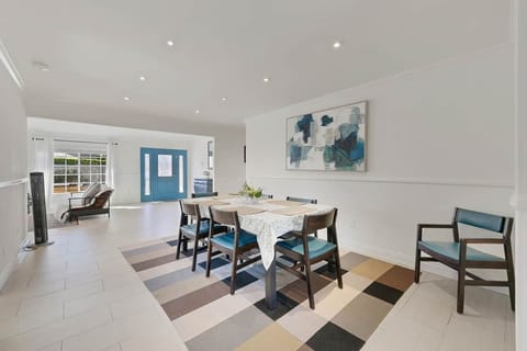 Dining room that seats 6 adults comfortably. Open floor plan, light and bright