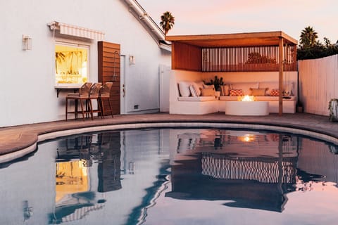 Gather up around the custom fire pit area or take a dip under the moody twilight reflection. 