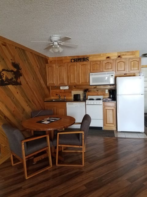 nice view of kitchen area, cabinets and drawers full of utensils, cookware, etc