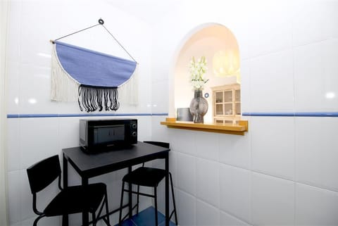 Dining table for two guests on a side of the kitchen