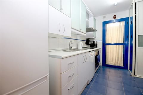 Fully fitted kitchen with laundry room to the rear
