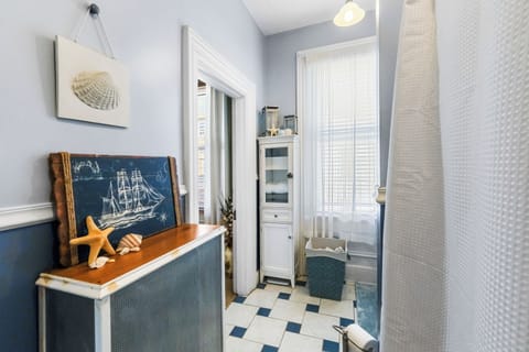 Freshen up in this bright family-friendly bathroom with soft coastal charm.