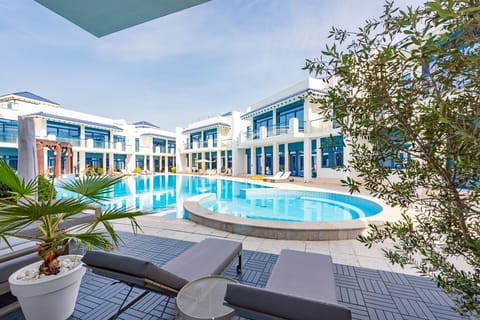 Beautiful and large climate controlled communal pool with separate jacuzzi and kids areas