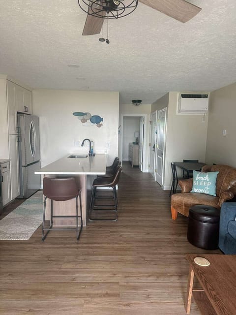 kitchen and hallway to primary bedroom