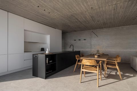 Fully equipped kitchen with a dining table comfortably seating 6 guests