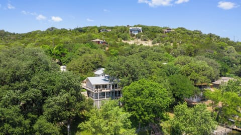 Peaceful lakeside oasis surrounded by the calming embrace of nature's greenery.
