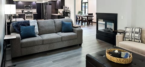 The living room flows into the expansive kitchen, dining room, and due to the open floor plan, it even flows into the upstairs master bedroom!