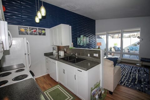 Kitchen opens to living room to visit while preparing food