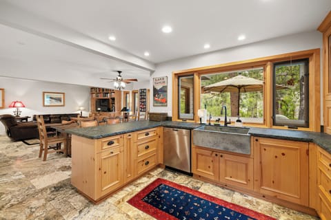 The kitchen offers waxed granite countertops
