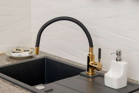 Kitchenette with a fridge.