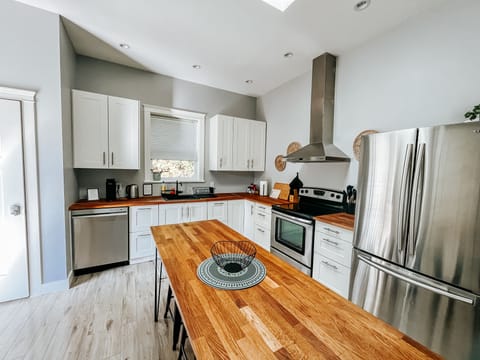 Full kitchen with stainless steel appliances and all cooking/baking necessities