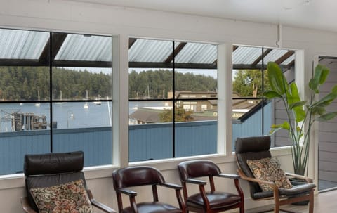 Open area with large spacious shared deck and partial water views.