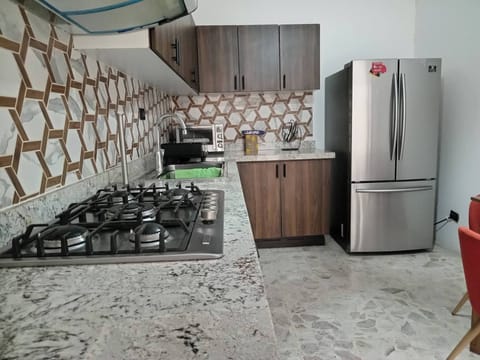 Fridge, microwave, stovetop, coffee/tea maker