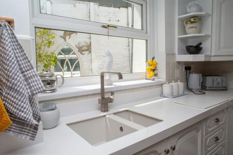 Kitchen with built in wall and base cupboards