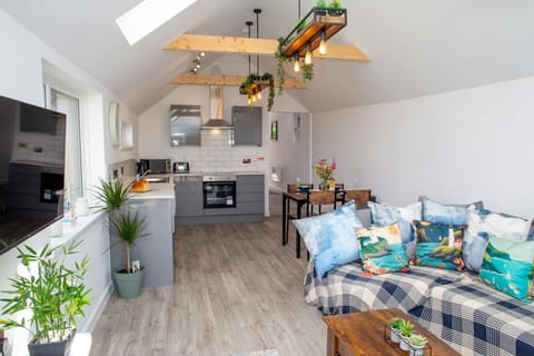 Wall mounted tv, sofa and coffee table