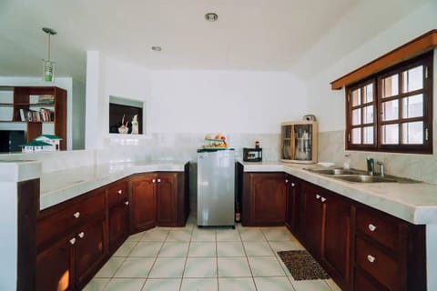 Fridge, stovetop, electric kettle, coffee grinder