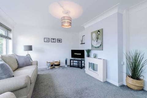 The spacious living space benefits from a 40-inch smart TV and plenty of space to sit down and relax.