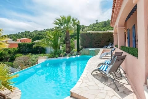 Enjoy a refreshing dip in the private pool, surrounded by lush greenery and the villa's charming stone patio. Relax on one of the lounge chairs and soak in the stunning view of the surrounding hills and the Mediterranean Sea in the distance. The pool can