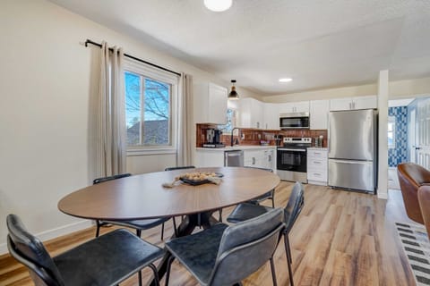 Gather around our spacious kitchen, complete with a 6-seater dining table, essential appliances like a fridge and oven, and a convenient coffee maker. From morning brews to family dinners, this is where delicious memories are made.