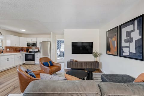 Kick back and relax in our stylish living room equipped with a state-of-the-art smart TV. Whether it's movie night or catching up on your favorite series, immerse yourself in entertainment at its finest. Your cozy retreat awaits!
