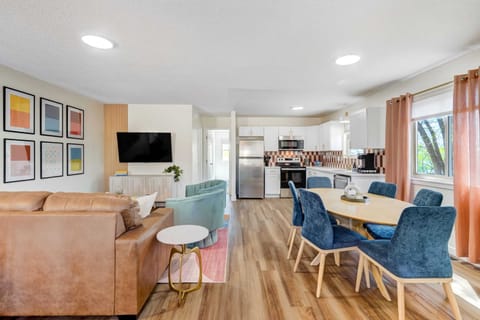 Entertain and dine in style in our living room space, equipped with a smart TV and a dining table for seamless transitions between meals and movies