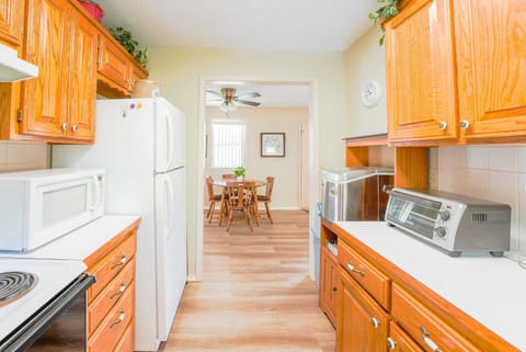Wooden cabinets bring a timeless and sophisticated feel to the space, infusing the room with warmth and character.
