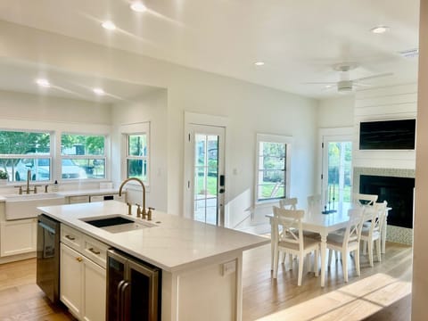 Large kitchen and dining area, ceiling fan, gas fireplace, walk out patio