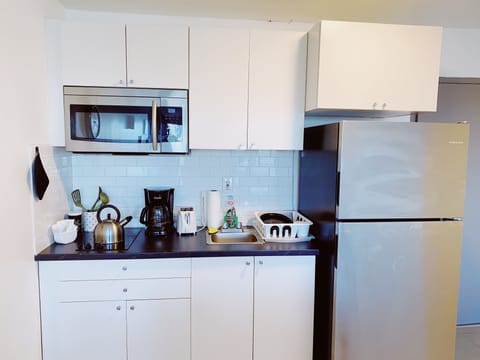 Fridge, microwave, stovetop, coffee/tea maker