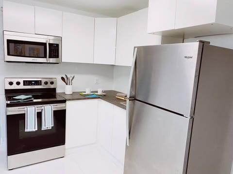 Fridge, microwave, stovetop, coffee/tea maker