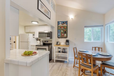 Adjacent to the kitchen.