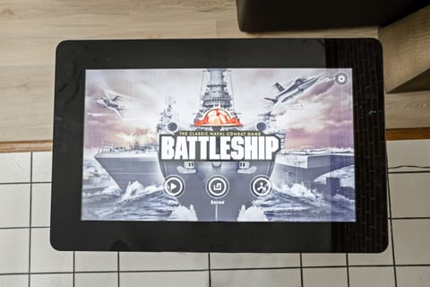 Challenge your friends and family to a game of Electronic Battleship at our fun-filled game table – perfect for some friendly competition and memorable moments!