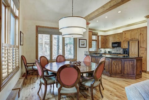 Dine in style in the inviting dining area, featuring a beautiful dining table, comfortable chairs, and easy access to the kitchen for seamless meal preparation.